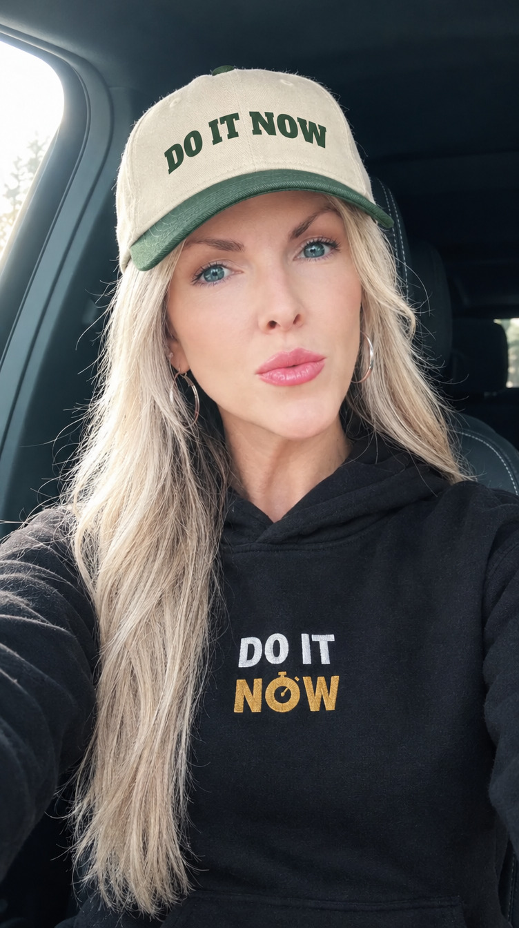 Natalie in a Do It Now cap and hoodie